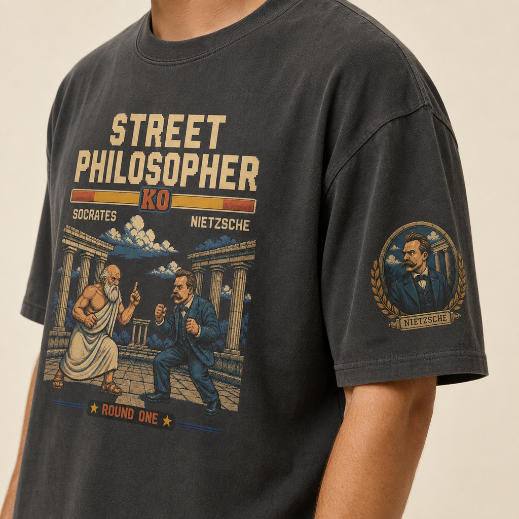 Close-up of the Nietzsche left-sleeve print on the premium oversized tee